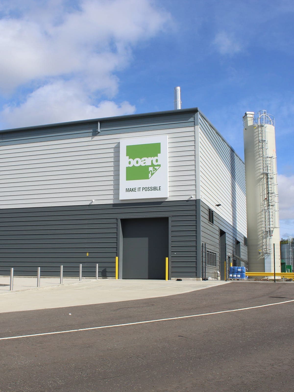 The end wall and loading door, with silos alongside
