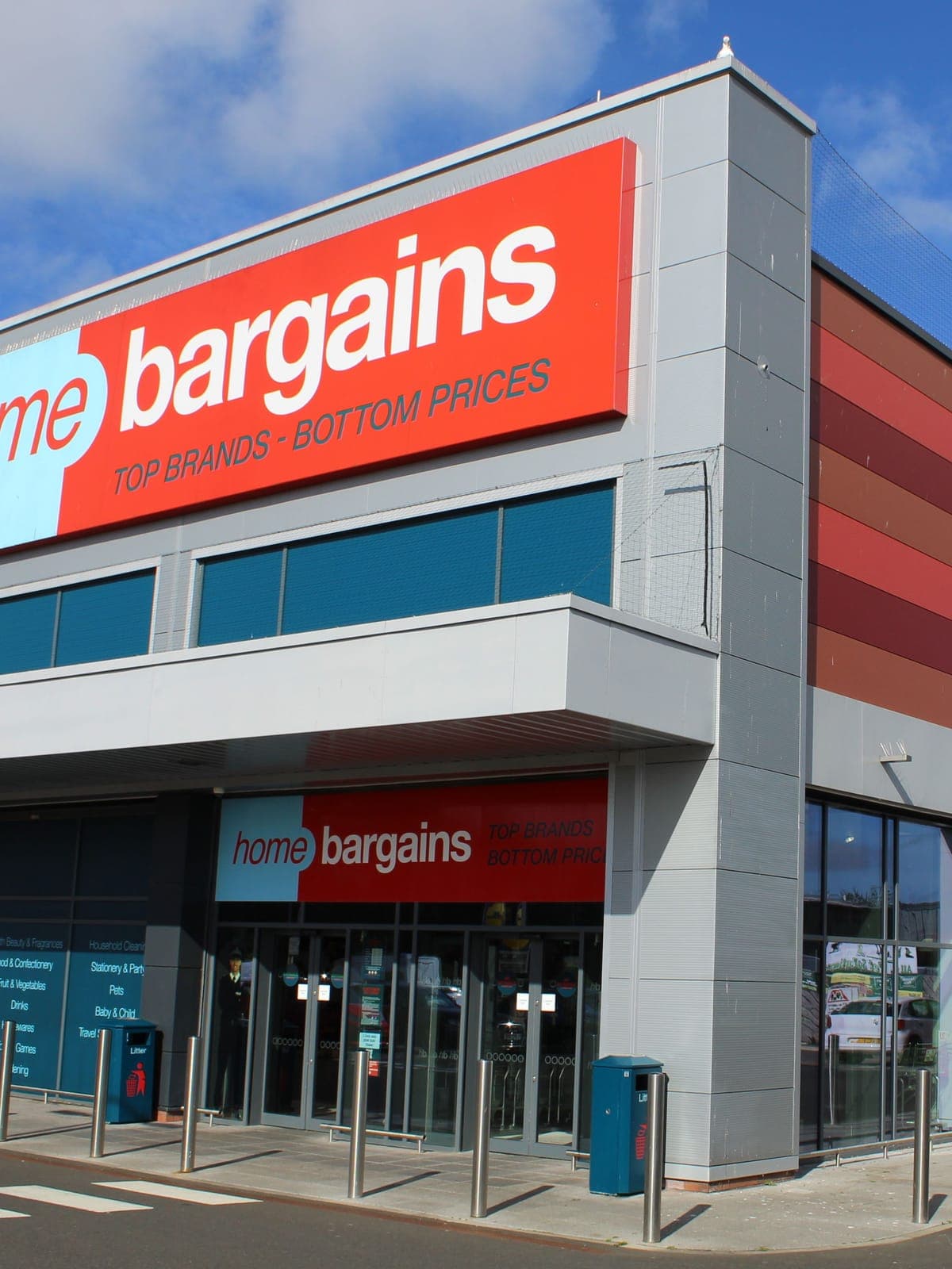 The store entrance under its canopy, with the main sign above