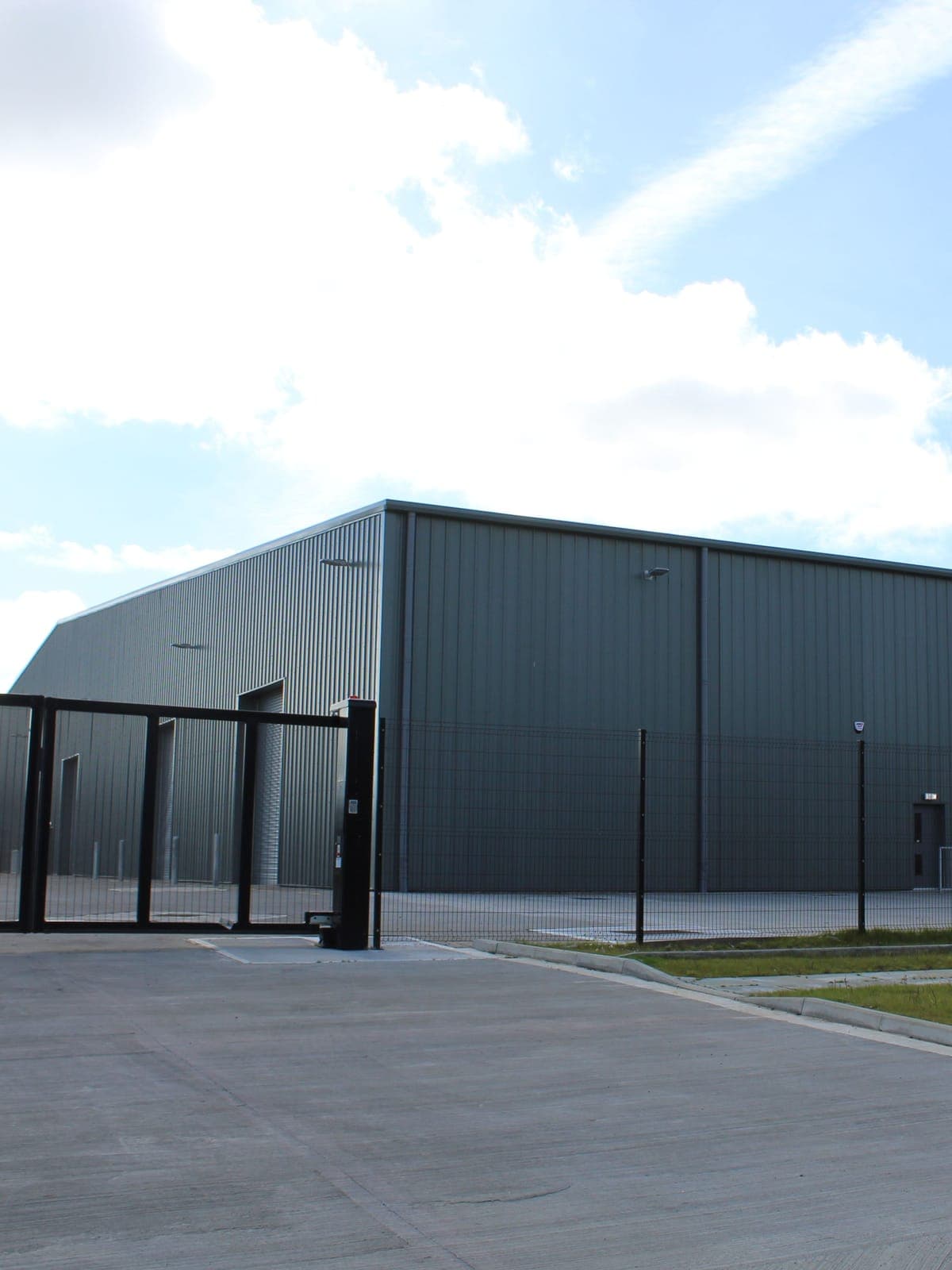 The corner of the warehouse and the yard gates