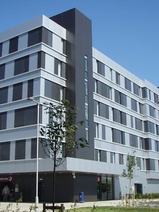 The re-clad hotel at Pacific Quay: grey and white aluminium rainscreen panels