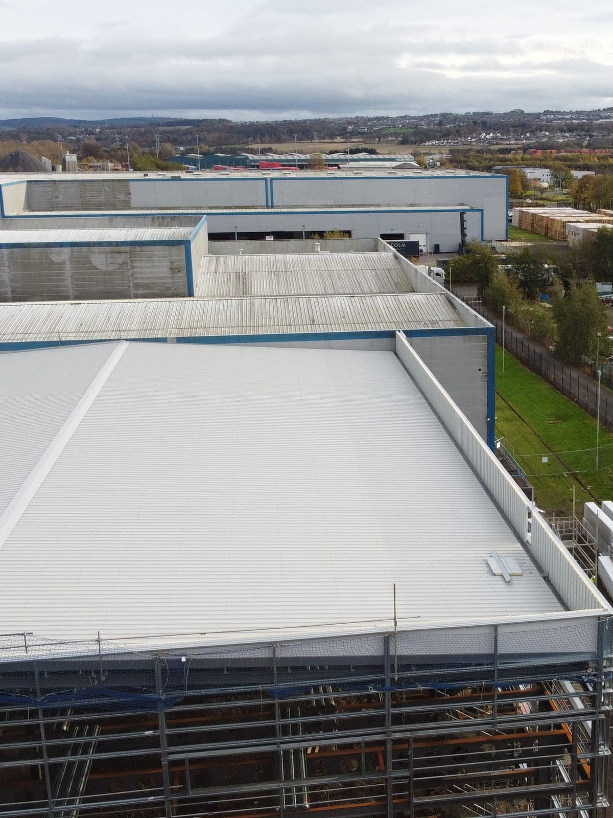 The finished roof sheets, with the existing warehouses behind